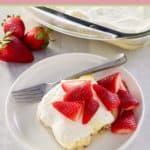 slice of lemon lush dessert and a fork on a plate.