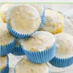 glazed lemon poppy seed muffins on a glass platter.