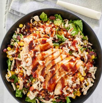 overhead view of copycat Panera BBQ chicken salad and a fork on a napkin.