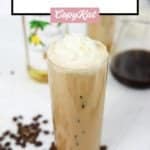 homemade Starbucks iced vanilla latte with whipped cream on top.