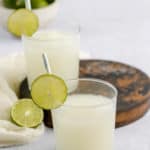 glasses of copycat Taco Bell pina colada frutista freeze and limes.