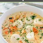a bowl of seafood bisque with a lot of sea scallops