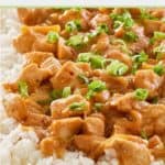 a plate of spicy peanut chicken and rice