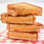 a stack of grilled cheese sandwiches.