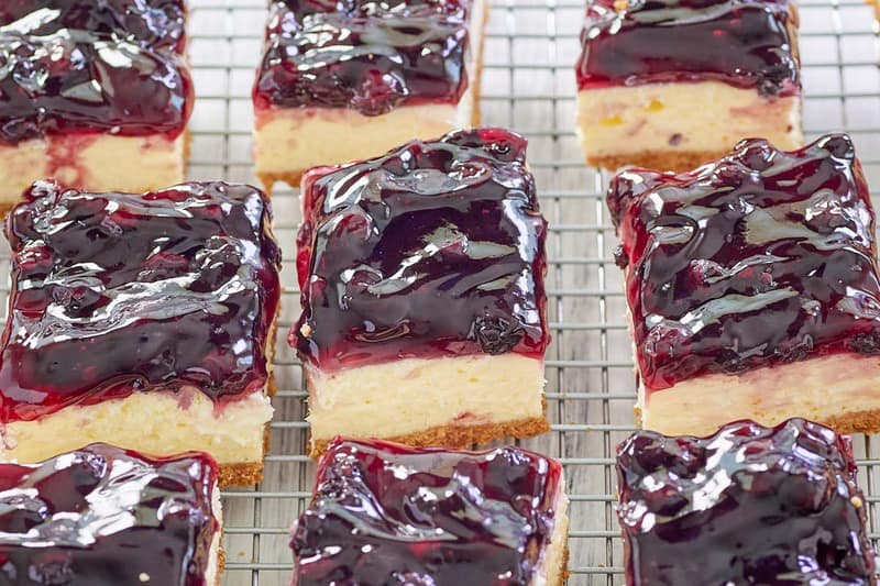 nine blueberry cheesecake bars.