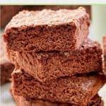 four fudge brownies in a stack.