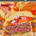 homemade double garlic burger with cheese on a wood board.