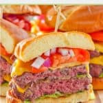 homemade garlic burgers with cheese on a wood board.