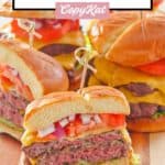homemade garlic burgers on a wood board.