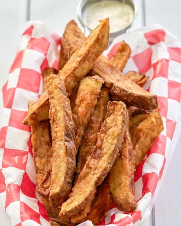 homemade potato wedges and dipping sauce.
