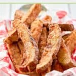 homemade potato wedges in a parchment paper lined wire basket.
