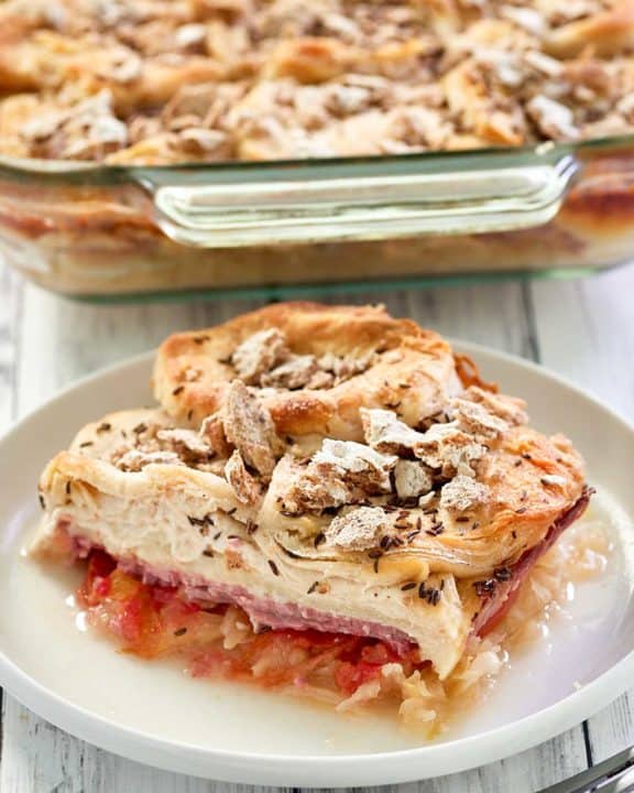 reuben casserole on a plate in front of the casserole dish.
