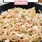 cold shrimp pasta salad in a black bowl.