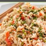 Thai chicken fried rice and chopsticks on a platter.