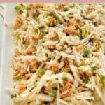 crunchy Asian slaw with ramen noodles on a platter.