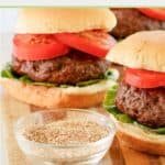 small bowl of homemade burger seasoning and hamburgers.