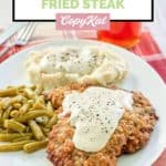 cracker barrel country fried steak, gravy, mashed potatoes, and green beans.
