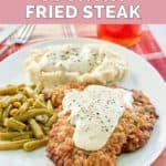 copycat Cracker Barrel country fried steak topped with gravy.