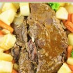 Instant pot pot roast, potatoes, and carrots on a platter.