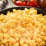closeup of macaroni and cheese in a cast iron skillet.