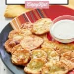 mojo potatoes and dipping sauce on a colorful plate.