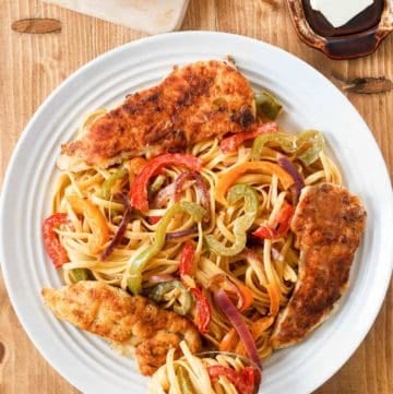 overhead view of copycat Olive Garden chicken scampi on a plate.