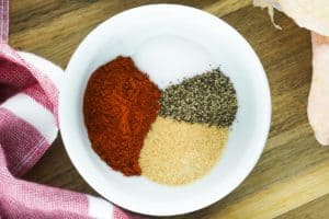 seasonings for smoked chicken thigs in a bowl.