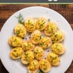 overhead view of smoked deviled eggs on a round platter.