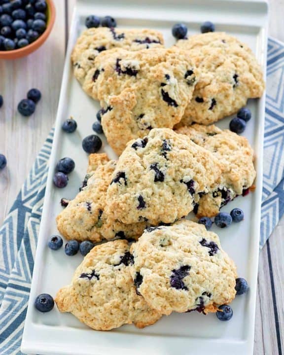 copycat Starbucks blueberry scones and a bowl of blueberries.