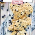 overhead view of homemade Starbucks blueberry scones and fresh blueberries.