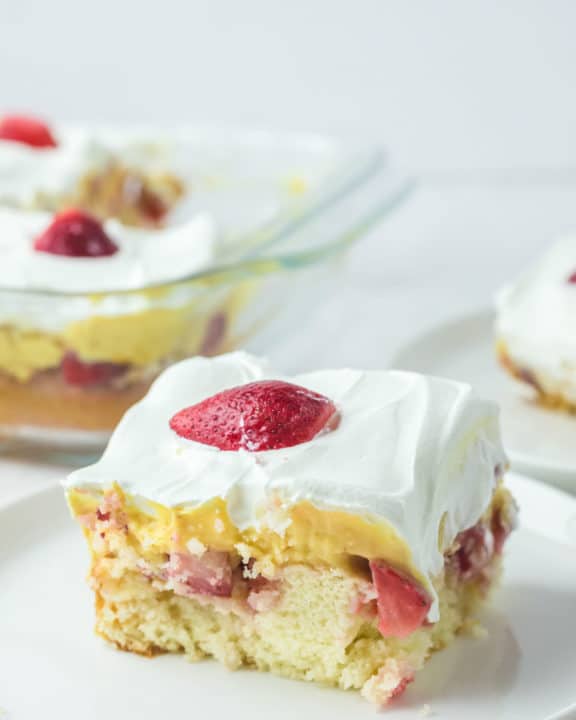 strawberry poke cake slice on a plate.