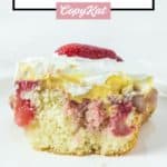 a slice of strawberry poke cake on a white plate.