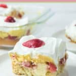 a slice of strawberry poke cake on a plate.