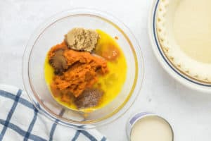 sugar free pumpkin pie filling ingredients in a mixing bowl.