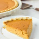 sugar free pumpkin pie slice on a plate.