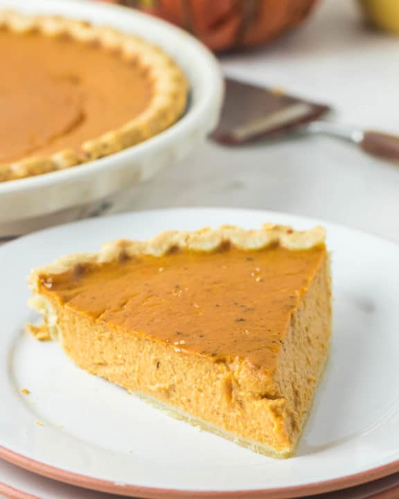 sugar free pumpkin pie slice on a plate.