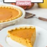 slice of sugar free pumpkin pie on a stack of plates in front of the pie.
