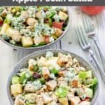 bowls of homemade apple pecan salad with chicken and two forks.