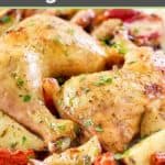oven baked chicken leg quarters and vegetables on a platter.