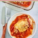 overhead view of baked chicken parmesan serving on a plate.