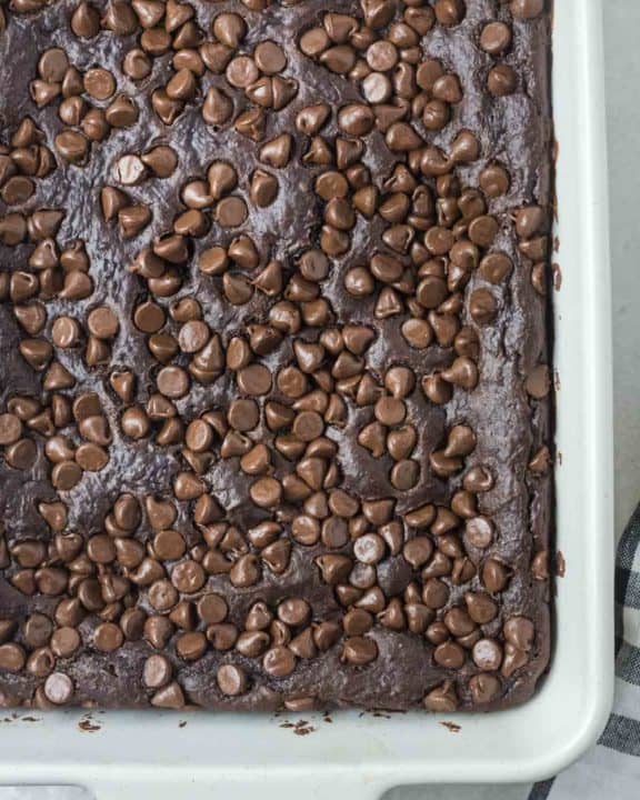 overhead view of chocolate pudding cake with chocolate chips.