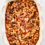 copycat cracker barrel bacon baked beans in a serving dish.