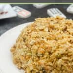 cream cheese cheese ball covered in nuts on a plate.