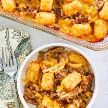 overhead view of hamburger hashbrown casserole in a baking dish and bowl.