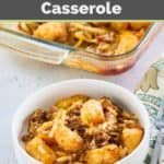 hamburger hashbrown casserole with cheese in a white bowl.