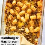 overhead view of hamburger hashbrown casserole and wooden spoon.