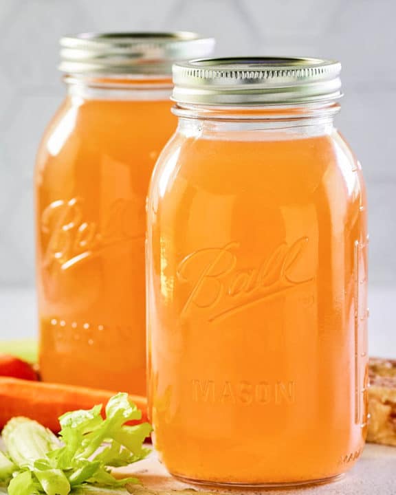 Instant Pot beef bone broth in two mason jars.