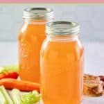 homemade beef bone broth in jars and vegetables.