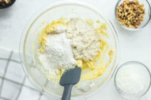 adding flour to water soaked oats.