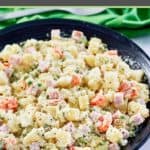 olivier salad in a larger black serving bowl.